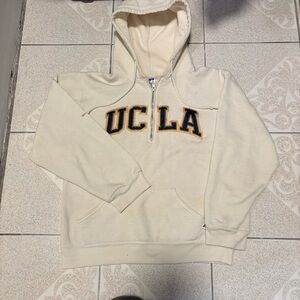 Cream and black UCLA Bruins zip-up hoodie